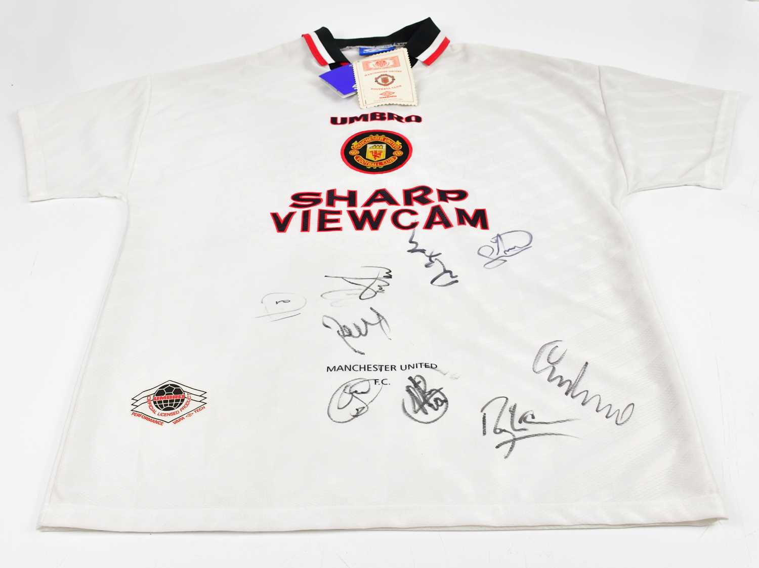 Lot 5212 - MANCHESTER UNITED; an Umbro football shirt...