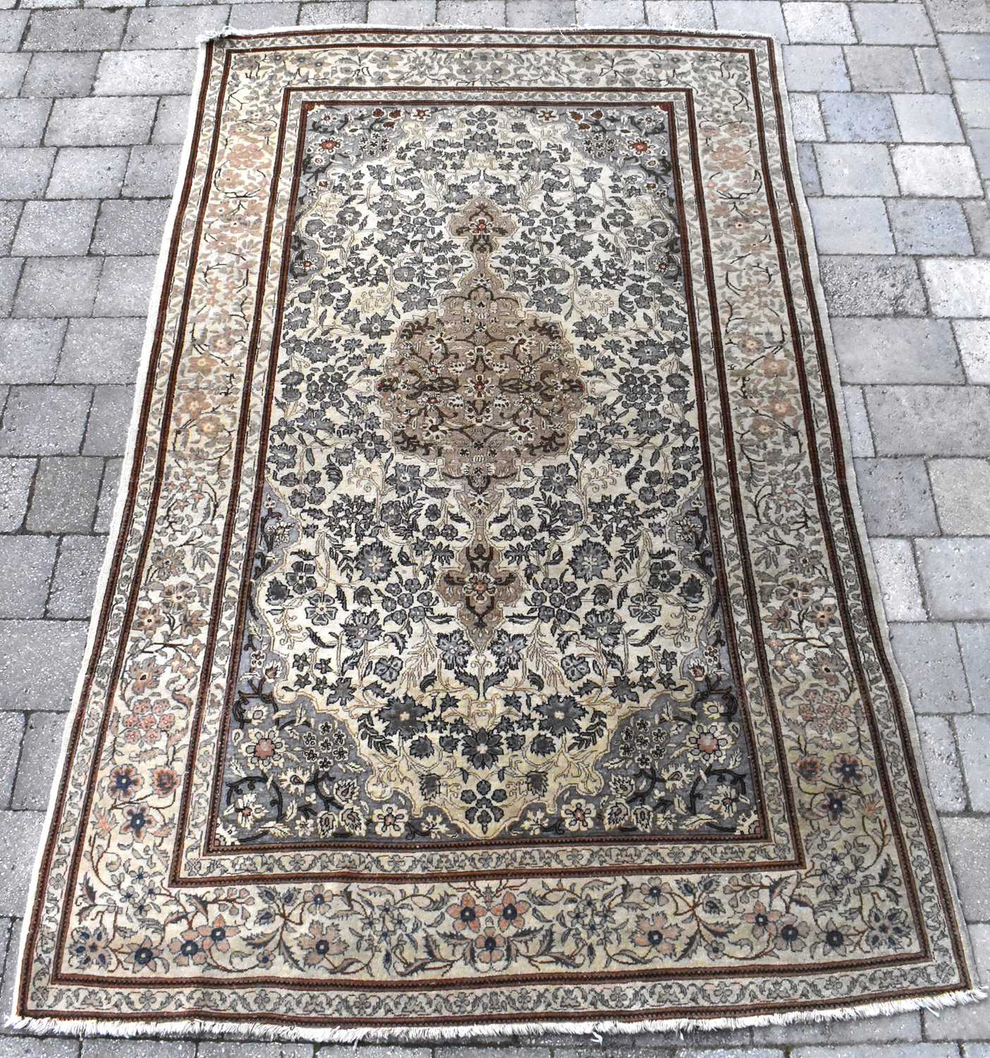 Lot 125 - A 20th century Eastern rug with centred
