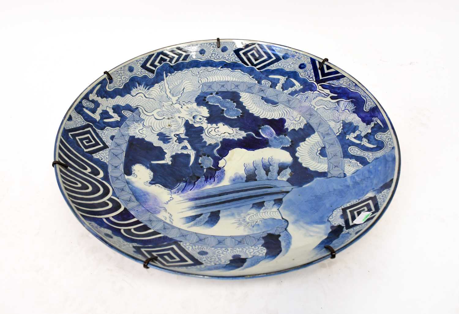 Lot 394 - A 19th century Japanese blue and white charger...