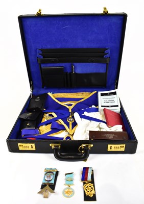 Lot 77 - A modern leather briefcase containing assorted...