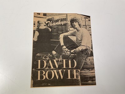 Lot 2069 - DAVID BOWIE; a newspaper cut clipping bearing...