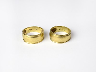 Lot 1068 - Two matching 9ct yellow gold rings, each size...