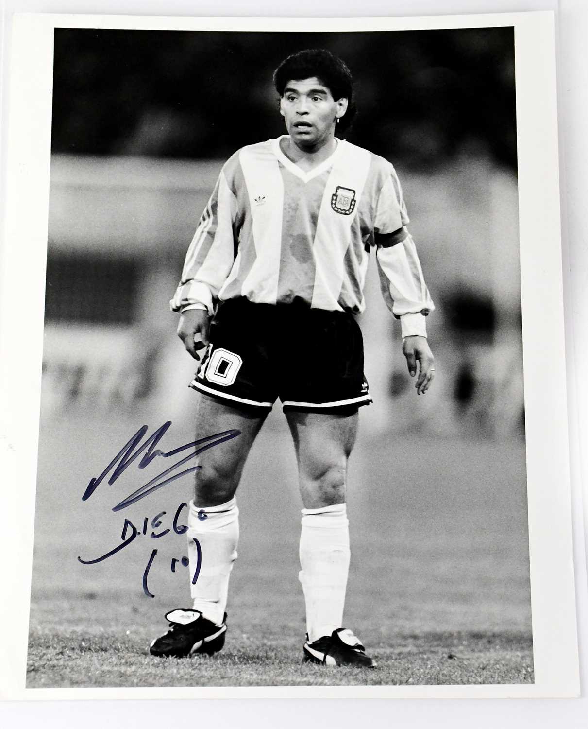 Lot 752 - DIEGO MARADONA; a black and white promotional...