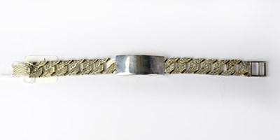 Lot 1190 - A hallmarked silver identity bracelet, London...