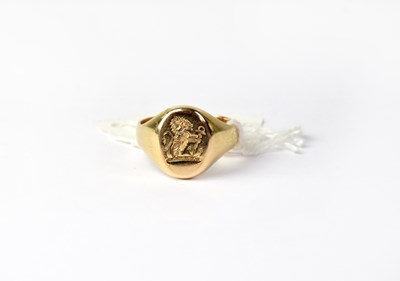 Lot 1011 - A 9ct yellow gold signet ring with lion and...