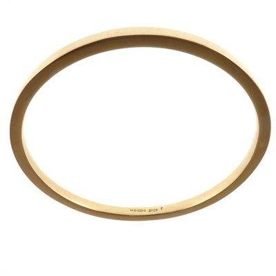 Lot 1179 - A 9ct gold square tubular bangle, hallmarked...