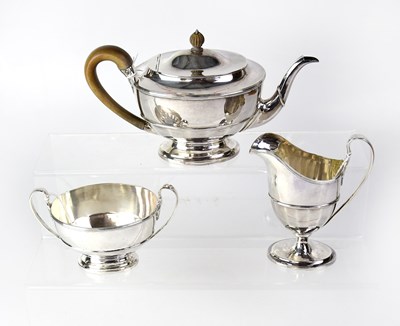 Lot 892 - A George V hallmarked silver three-piece tea...