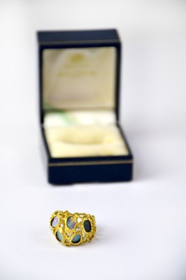 Lot 1006 - An 18ct yellow gold ring of abstract coral...