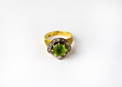 Lot 1007 - An 18ct yellow gold ring, the central...