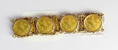 Lot 1149 - A 14ct yellow gold link bracelet set with...