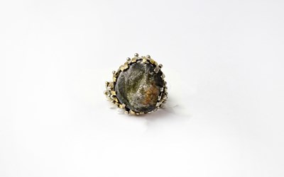 Lot 1036 - A circa 1980s handmade designer ring by Jon...