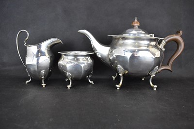 Lot 890 - A George V hallmarked silver three-piece tea...