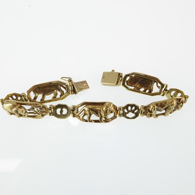 Lot 1157 - A 9ct gold bracelet with five oval links, each...