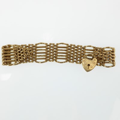 Lot 1160 - A 9ct gold seven bar gate bracelet united with...