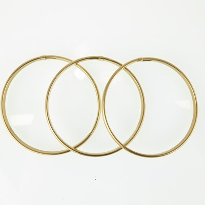Lot 1183 - Three matching 9ct gold hollow bangles,...