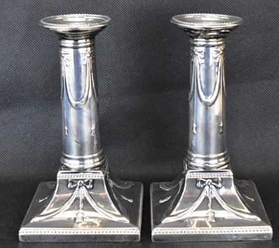 Lot 853 - A pair of George V hallmarked silver loaded...