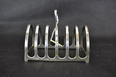 Lot 907 - A George VI hallmarked silver six-slot toast...