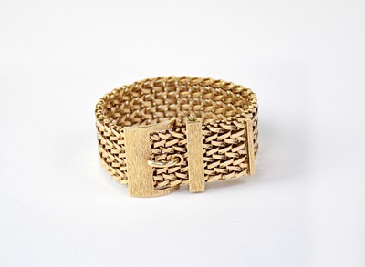 Lot 1178 - A 9ct gold bracelet in the form of an...