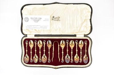 Lot 900 - An Edwardian cased set of twelve gilt silver...