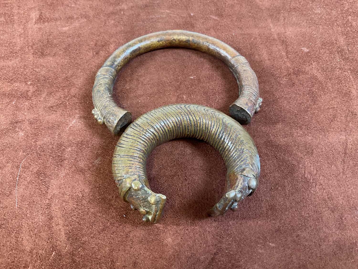 Lot 17 - Two bronze Manilla slave trading bangles.