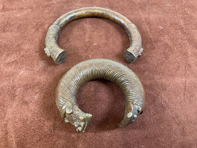 Lot 17 - Two bronze Manilla slave trading bangles.