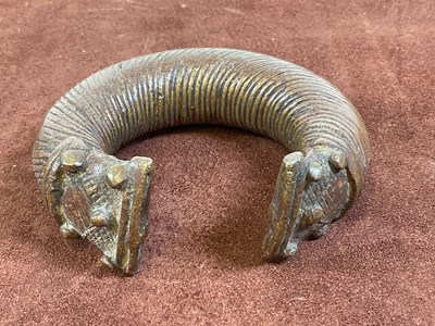 Lot 17 - Two bronze Manilla slave trading bangles.