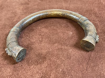 Lot 17 - Two bronze Manilla slave trading bangles.