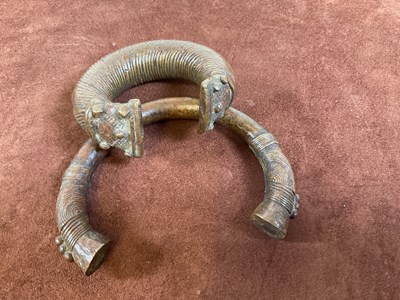 Lot 17 - Two bronze Manilla slave trading bangles.