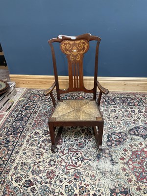Lot 2462 - A 19th century inlaid rocking chair.