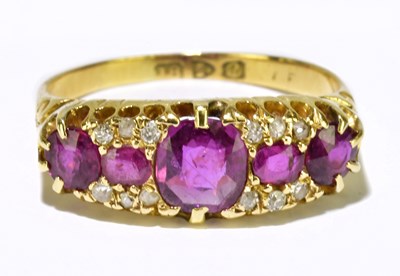 Lot 64 - An 18ct yellow gold ruby and diamond ring set...