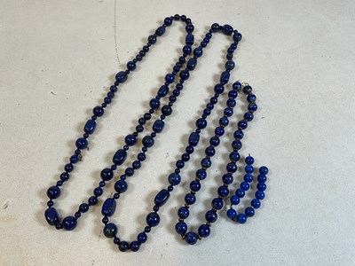 Lot 356 - Three lapis lazuli style beaded necklaces,...