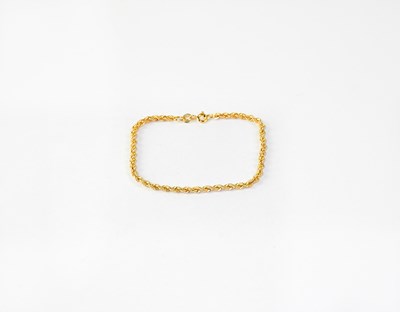 Lot 1150 - A 10ct yellow gold link bracelet, approx. 1.36g.