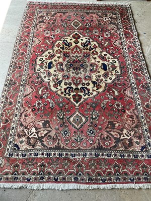 Lot 436 - An Iranian red ground Hamadan rug, 264cm x 162cm.