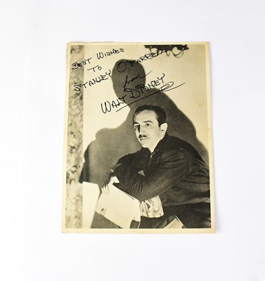 Lot 131 - WALT DISNEY; a black and white promotional...