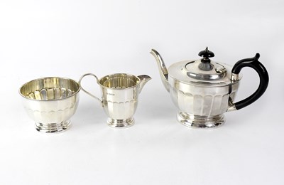 Lot 889 - A George V hallmarked silver three-piece tea...