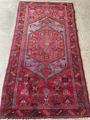 Lot 439 - A Khamseh red ground rug, 205 cm x 105cm.