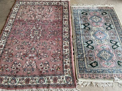 Lot 440 - Two rugs, one on pink ground from India, 190cm...