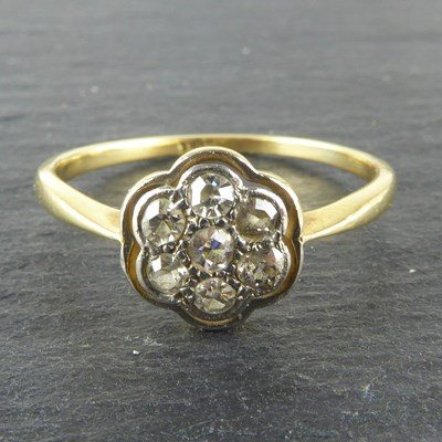 Lot 1061 - An Art Deco 18ct gold seven stone diamond...