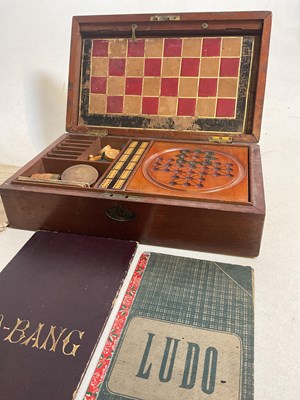 Lot 5 - An Edwardian walnut cased games compendium...