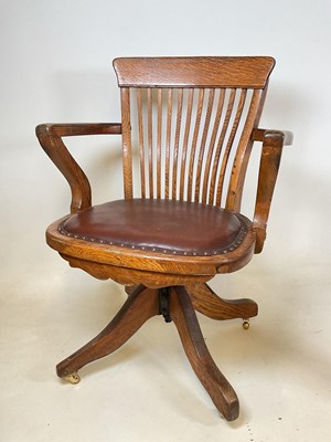 Lot 503 - A 1920s oak swivel office chair