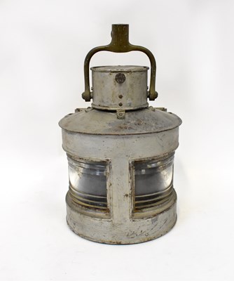 Lot 130 - An aluminium ship's lamp stamped GP Ld 1943,...