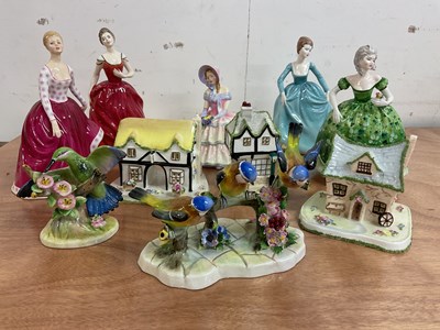 Lot 239 - A collection of figures including Coalport...