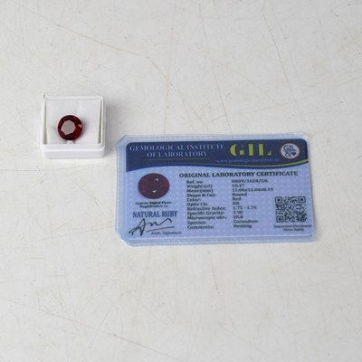 Lot 1372 - A loose 10.47 carat round ruby with GIL...