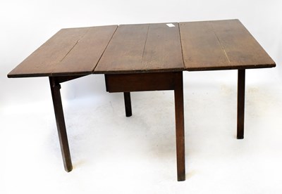 Lot 33 - A 19th century oak drop-leaf supper table on...