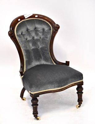 Lot 48 - A Victorian carved walnut nursing chair, with...