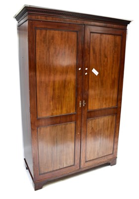 Lot 11 - An early 20th century mahogany double wardrobe...