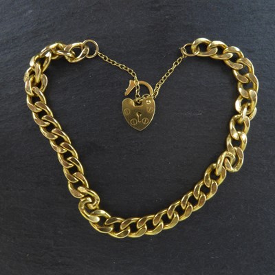 Lot 1174 - A 9ct yellow gold curb link bracelet, length...