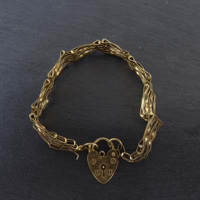 Lot 1162 - A 9ct gold five bar gate bracelet with...