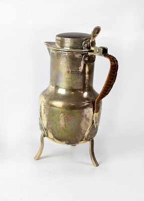 Lot 882 - An Edwardian silver Arts and Crafts hot water...