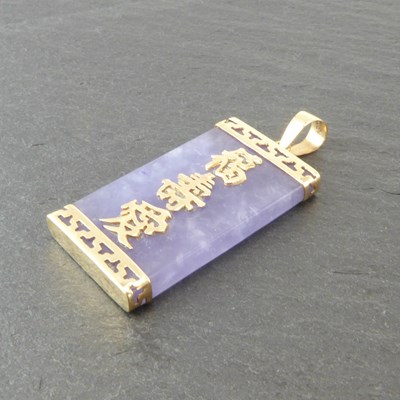 Lot 1237 - A Chinese purple/lavender jade pendant with...